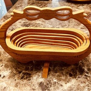 Vintage oak folding collapsible basket with bow detail.